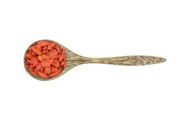 goji berries in wood spoon on white background