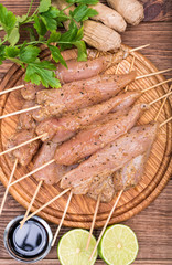 Thai raw chicken satay . Concept of cooking.