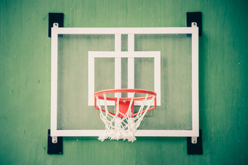 Basketball hoop in gymnasium