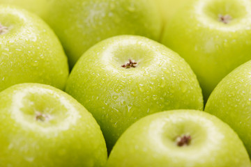 Green fresh apples close up, selective focus.