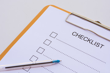 Checklist concept - checklist, paper and a pen with checklist wo
