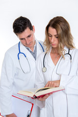 Fototapeta premium young friendly medical team with book in lab coat
