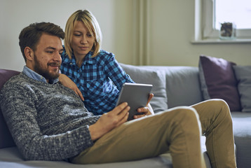 Couple looking at tablet