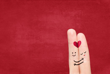 Couple in love with your finger on a solid background.