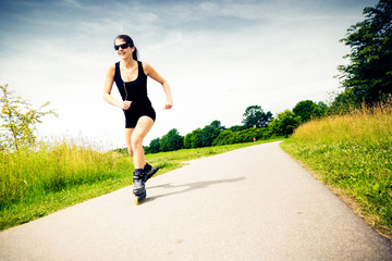 Young Woman With Inline Skates