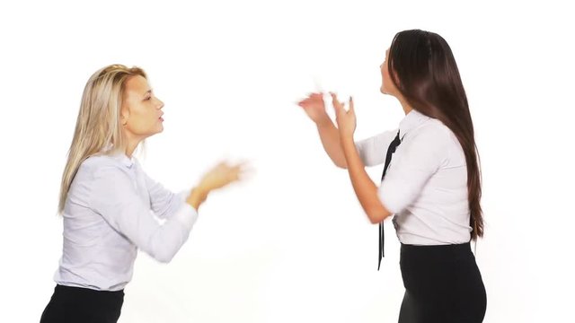 Two business women arguing and getting into a fight