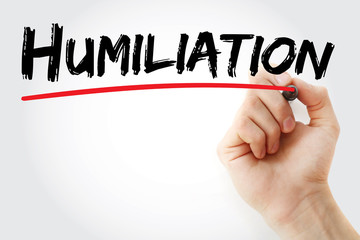 Hand writing Humiliation with marker, concept background