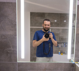 Man with camera in mirror