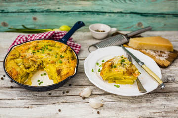 Frittata with potatoes and smoked salmon. Tasty Italian food.
