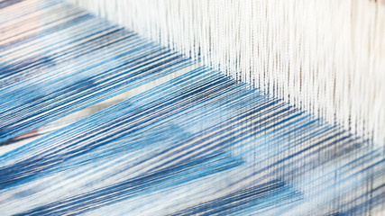 Closeup, abstract motion blur of silk fabric weaving