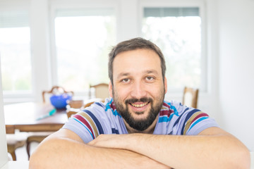 Fototapeta premium Attractive smiling man relaxing at home