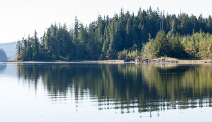 Fototapeta na wymiar Reflections on an inlet on Vancouver Island