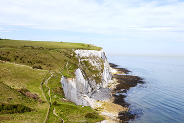 Coastal walking path overlooking the English Channel and white cliffs of Dover, south east England,...