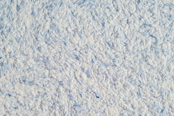 Abstract texture of decorative plaster liquid wallpaper close up macro photo