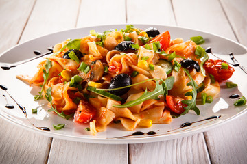 Pasta with meat, tomato sauce and vegetables 
