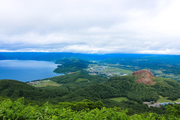 Showa-shinzan mountain is a volcanic lava dome in the Shikotsu-Toya National Park, Hokkaido, Japan, next to Mount Usu. It also has ropeway up to Mount Usu.