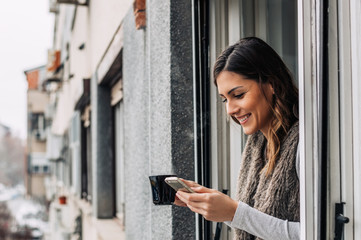 Fototapeta premium Drinking coffee, chilling, message typing. Smartphone and coffee