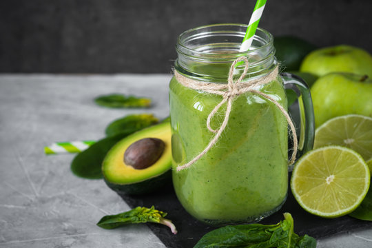 Healthy green smoothie in mason jar. Superfood drink