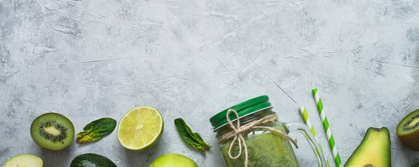 Healthy green food background - smoothie and ingredients. Long banner format for web.