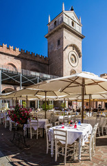 Street restaurants at Mantova in summer night. Italy