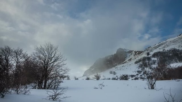 Rock Eklizi Burun under a blue sky with clouds. Timelapse. Crimea. Russia