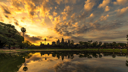 Angkor Wat in Siem Reap, Cambodia during sunrise with reflection in water. - obrazy, fototapety, plakaty