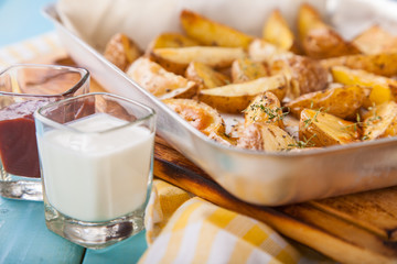 Close up Freshly Cooked Hot Spicy Potato Wedges, selective focus, copy space