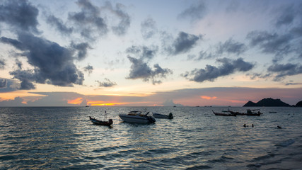 Sunset landscape of the sea and boat in twilight time at koh tao, thailand