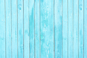 Fototapeta na wymiar blue old wooden fence. wood palisade background. planks texture
