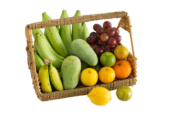 Fresh fruits in rattan basket isolated on white background