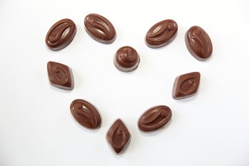 Chocolate candy hearts on a white background 