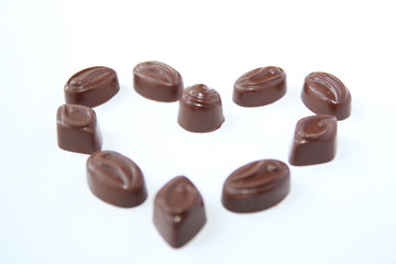 Chocolate candy hearts on a white background 