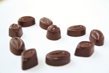 Chocolate candy hearts on a white background 