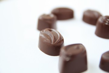 Chocolate candy hearts on a white background 