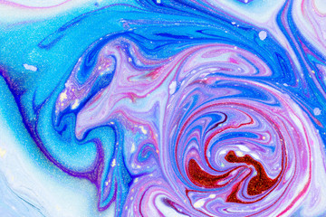 Abstract background swirls with dyes and glitter