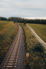 railroad in landscape between fields, green, nature