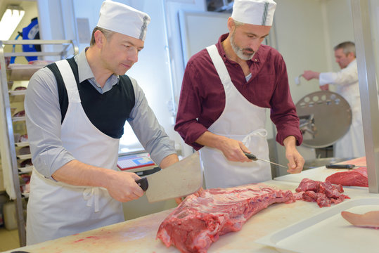 butchers cutting meat
