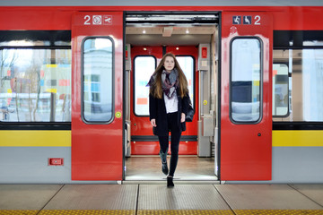 Fototapeta Young woman on a train station. obraz