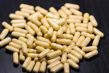 Medication and pills on a black background 