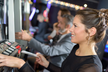 Woman playing arcade game