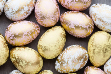 Easter eggs painted in colors on a pattern background.