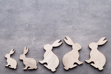 Fototapeta premium Handmade wood easter rabbits on wooden background.