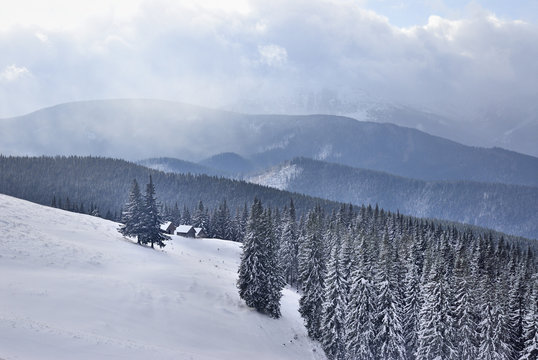 Dramatic commit of snow storm in mountain to little houses