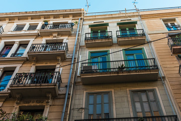 Fototapeta na wymiar typical spanish apartment building in low angle view