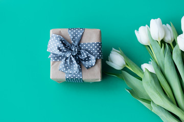 White tulips bouquet and gift box