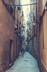 old and beautiful street at barcelona with blurred person