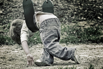 Young boy playing on a swing
