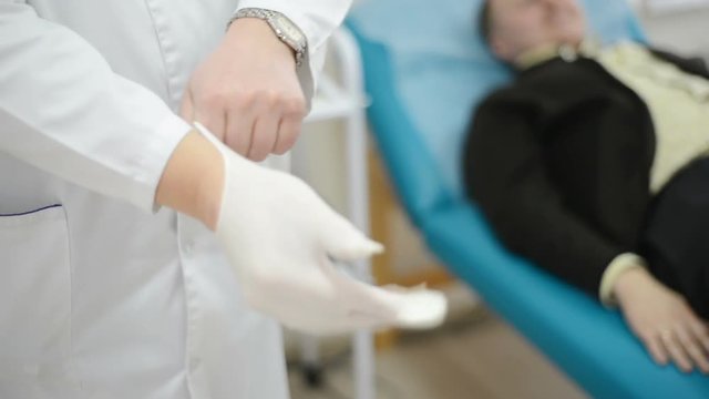 doctor, urologist wear medical gloves