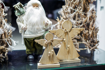 Santa Claus and Christmas angels in the showcase 
