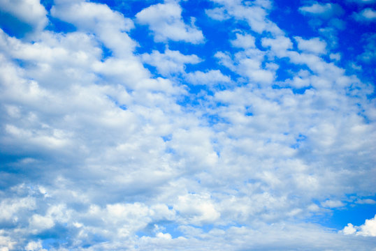 Bright blue summer sky with beautiful fluffy white clouds overlay